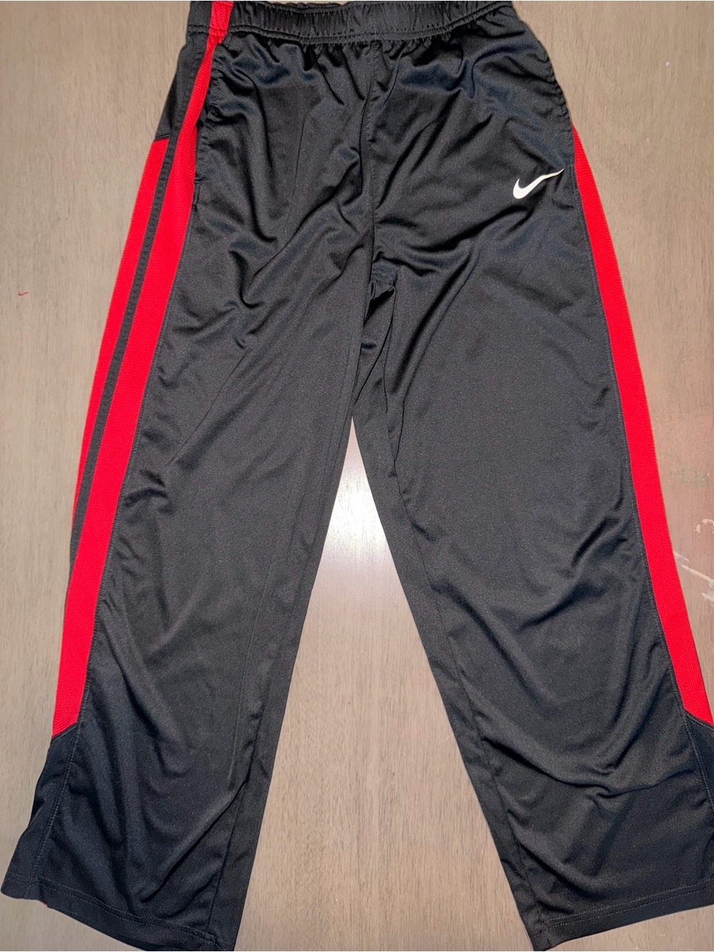 Nike Kids Black Athletic Track Pants with Red Side Stripes